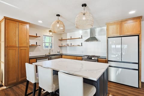 Gather around the heart of the home: where culinary delights meet riverside charm.