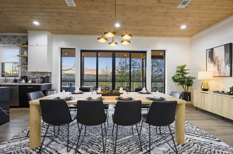 Enjoy the stellar views through the ginormous glass doors leading out to the amazing covered back deck!Dine at our lovely dining room table, high chair provided!