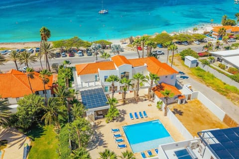 Coastal villa with pool, just steps from the beach.