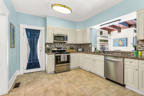 Prepare to unleash your culinary creativity in this fully-equipped kitchen! Stocked with indoor and outdoor dining sets, an array of cooking utensils, bakeware, and a variety of appliances including a blender, toaster, microwave, and more.
