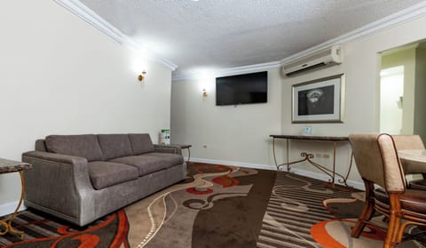 Grand Suite | Living area | 40-inch Smart TV with cable channels