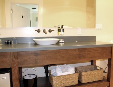 Combined shower/tub, designer toiletries, hair dryer, bathrobes