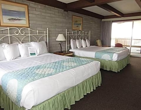 Room, 2 Queen Beds, Refrigerator, Beachfront | Free WiFi, bed sheets