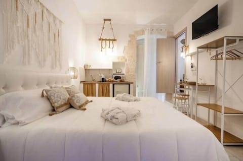 Premium bedding, down comforters, memory foam beds, laptop workspace