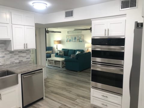 View of the Family/Living Room from the Kitchen. Convection Oven and Microwave. 