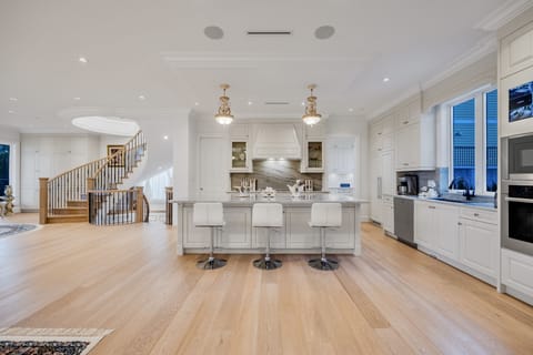 Guests who love to cook will love the large marble island and Miele appliances