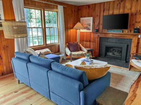 Comfortable furnishings and warm wood paneling welcomes you to this cozy cottage