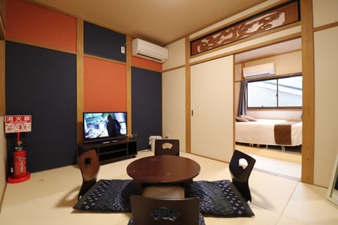 City Townhome, Non Smoking | Living room | Flat-screen TV