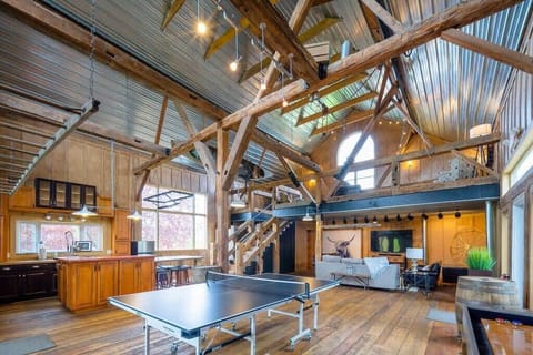 The Recreation Barn, complete with 2 TV's, ping pong and shuffleboard table, kitchenette, loads of board games and plenty of seating for entertaining!