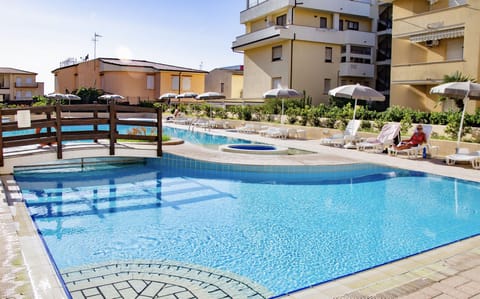 Seasonal outdoor pool, pool umbrellas, sun loungers