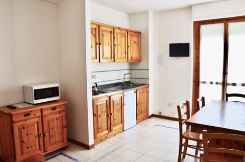 Apartment | Living area | 24-inch flat-screen TV with satellite channels