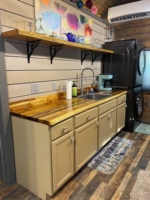 Left side of kitchen, with mini spit, Cabinets, Shelf with dishes