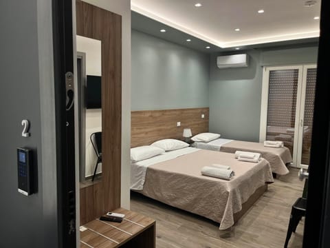 Family Triple Room, Kitchenette, City View | Free minibar items, in-room safe, soundproofing, free WiFi