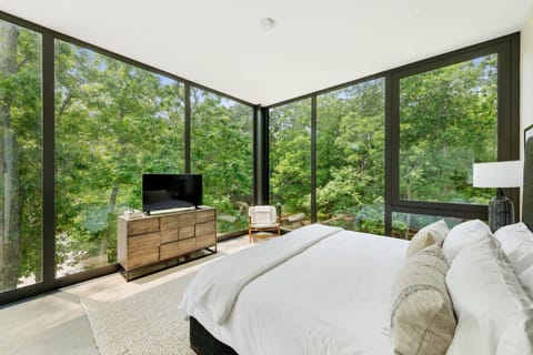 Let the stresses of the day drift away in this peaceful bedroom haven, designed with tranquility in mind, from the soft bedding to the tranquil views.