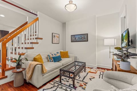 Living room with TV and comfy seating arrangement