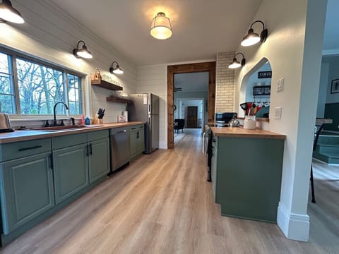 Brand new stainless steel appliances adorn the kitchen and stand ready to assist in your culinary adventures and family meals.