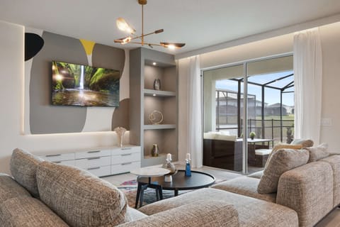 Enjoy quality time with loved ones in our inviting living room, offering a cozy space for relaxation.