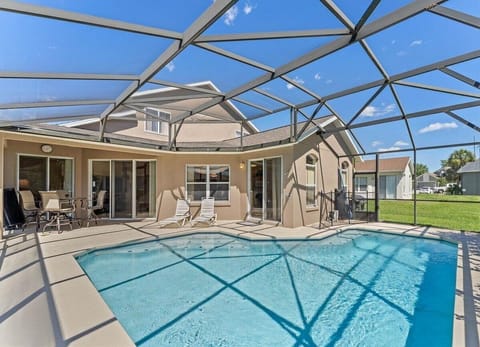 Soak up the Florida sunshine in your private south-facing screened pool