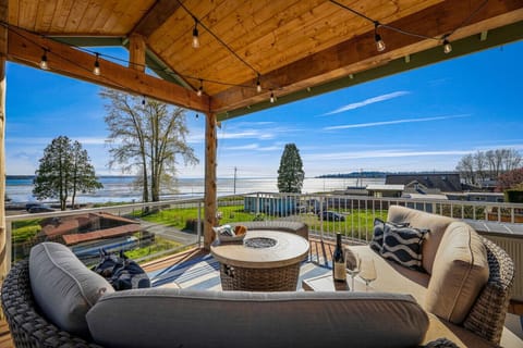 View from the deck! Covered seating and fire pit, BBQ and heat lamp.