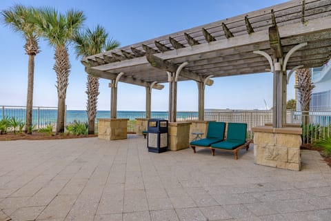 Covered outdoor seating with ocean views — a quiet spot to read or enjoy the breeze.