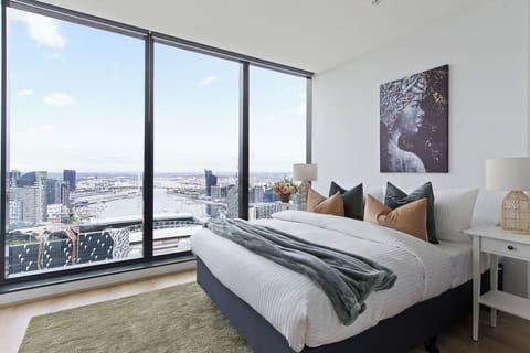The master bedroom with a queen sized bed & an amazing view.