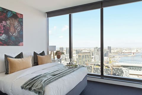 The master bedroom with a queen sized bed & an amazing view.