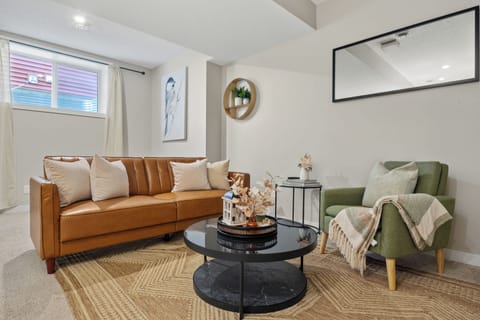 Cozy living area with modern décor and comfortable seating.