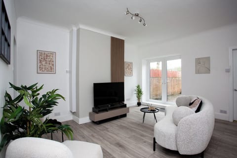 Welcome to your urban oasis in the heart of the city! Step into the spacious living room where modern elegance meets comfort!!