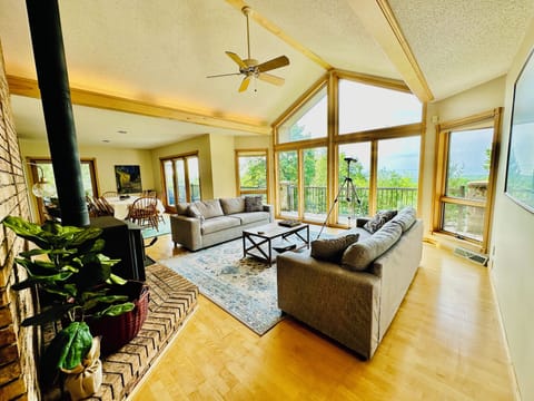 Spacious Living room with Floor-to-ceiling windows for natural lighting