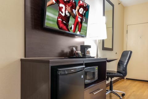 Desk, laptop workspace, blackout drapes, iron/ironing board