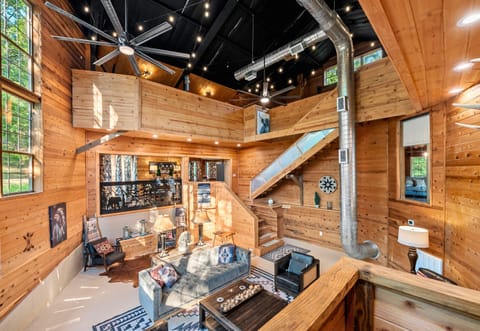 Cozy up in this inviting living room with its rustic charm, perfect for family gatherings and relaxation.