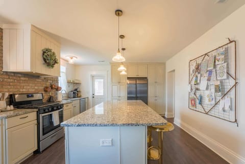 Cook up a feast in the fully stocked kitchen with granite island, stainless appliances & bar seating—made for foodies & entertaining.