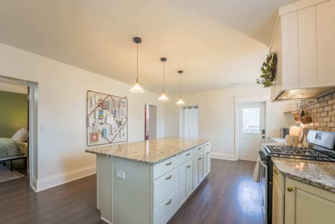 Entertain with ease in our kitchen, complete with extra bar seating and a layout that echoes the charm of our century-old home—perfect for happy gatherings.