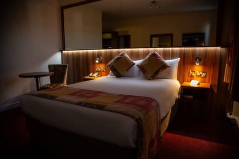 Desk, laptop workspace, blackout drapes, iron/ironing board