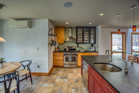 The spacious open kitchen comfortably accommodates seating for four, with an additional delightful kids' table for our younger guests to enjoy.