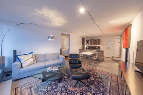 Luxury Condo | Living area | 55-inch Smart TV with cable channels, Netflix, heated floors