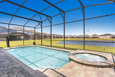 Soul Enhancing Pool area of the home in Kissimmee - Amazing Atmosphere - Completely sunbathed space - Stunning Pool with Hot tub