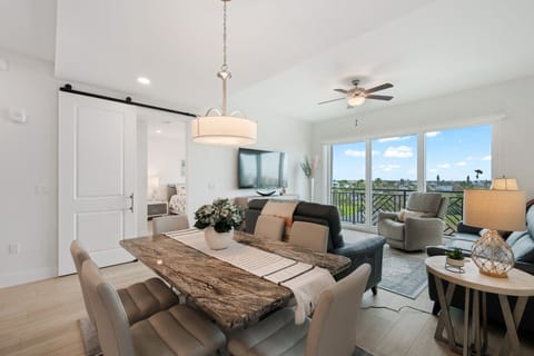 Open-concept dining & living area designed for easy meals, lounging & together time.