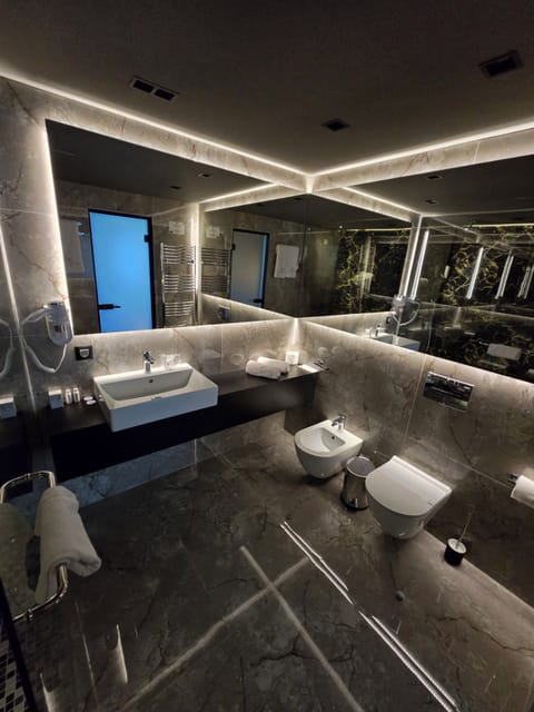 Suite, City View | Bathroom | Hair dryer, slippers