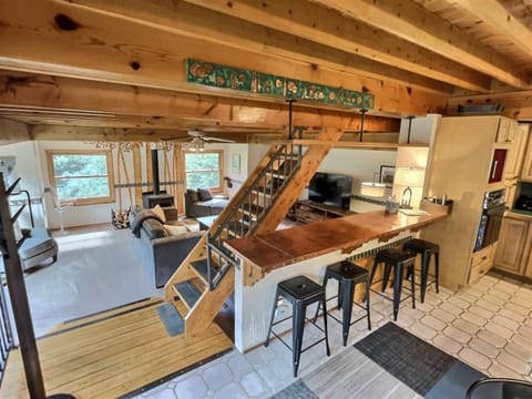 Entryway of the Home Accessing Kitchen, Dining, Living Area, and Stairs to King Suite