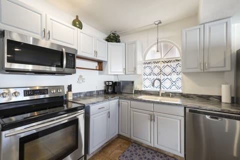 Well stocked kitchen with dish washer