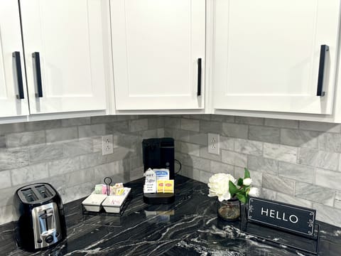 Complimentary coffee, tea, hot chocolate, sugars and creamers. Electric kettle