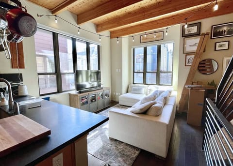 Family room open to the kitchen so the cook can be part of the action! Flatscreen TV and TONS of games for game night! *Ignore boxes for new dining cabinets!