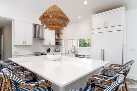 Gorgeous kitchen with stainless steel appliances, double ovens, and large kitchen island