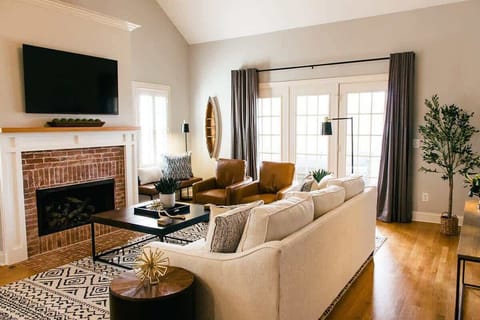 Cozy living space with a fireplace and mounted TV for laid-back evenings.