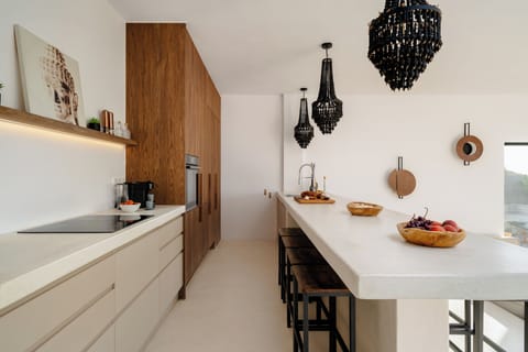 Very long kitchen island with space for dining for 8-10 persons