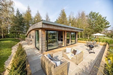 Exterior of Jules lodge with private patio at Brompton Lakes.