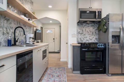 Cook up your favorites with our complete kitchen setup—featuring cookware, dishes, coffee maker, toaster, stove, oven, microwave, refrigerator, and more!