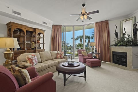 Living Area - The open living area features floor to ceiling 11ft. sliding glass doors, which lead out to a spacious balcony overlooking the Pool.