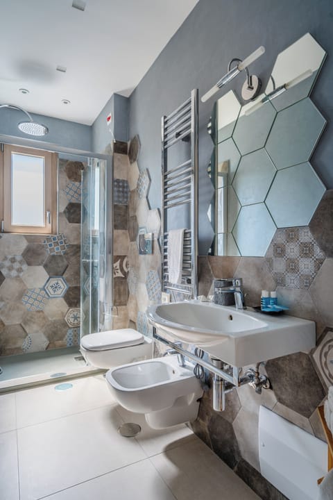 Family Room, Balcony, Garden View | Bathroom | Shower, free toiletries, hair dryer, bathrobes